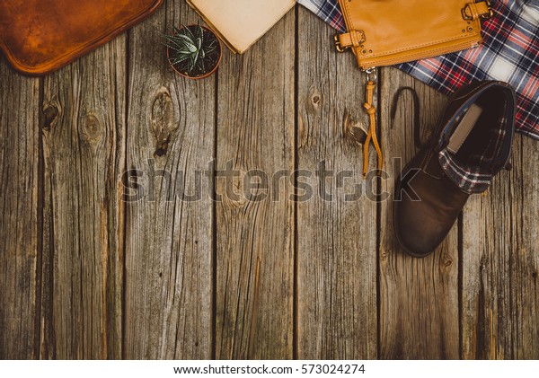 Accessories for\
travel top view on wooden background with copy space. Adventure and\
wanderlust concept image with travel accessories. Preparing for an\
exotic trip, journey and\
sightseeing.
