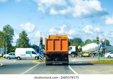 An accident at a busy road intersection: a dump truck ran a red light. Braking distance on the road. Road traffic accident. Copy space for text