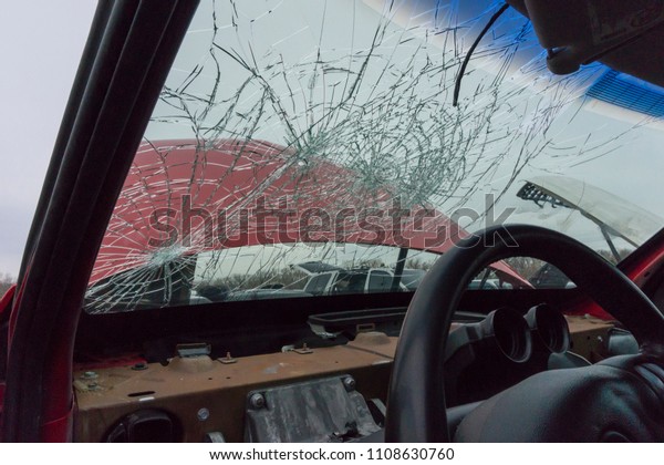Accident car with cracked\
windshield