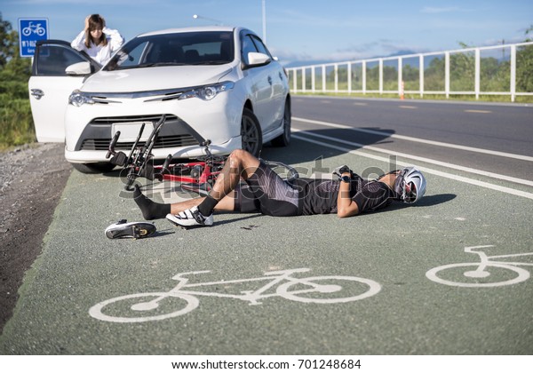 Accident car crash\
bicycle on bike lane.