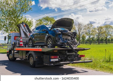 Accident car on a tow truck - Shutterstock ID 1624035400