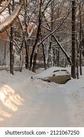 Accident Close-up, A Small Car Flew Off The Road On A Snowy And Icy Road. Accident Without Victims On A Snowy Forest Road With A Sharp Dangerous Turn