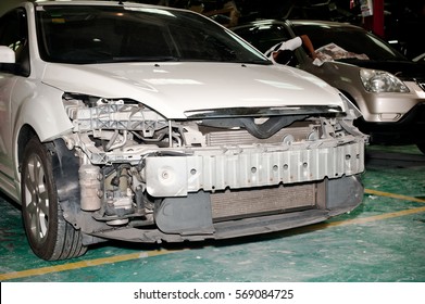 Accident Damaged Car Loss Bumper Guard Parked In Repair Body Work.