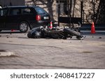 Accident with motorcycle at a crossroads. A motorcyclist