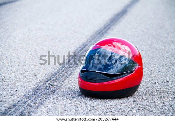 an accident with a motorcycle.\
traffic accident and skid marks on road. symbol\
photo.