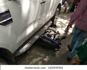 Accident Occurs In Bhu In Front Of Law Faculty In Which Bike Runs Rapidily Under The Car 0n 18 June 2019 At 1.30 Pm Varanasi Uttarpradesh India.