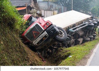 Accident On Mountainous Road, Motor Vehicle Accident, Car Wreck. Long Vehicle Overturned And Lying In Ditch On Side