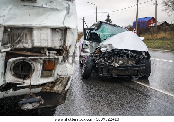 accident on a slippery road in\
cloudy weather of a bus and a car at a shallow depth of\
field
