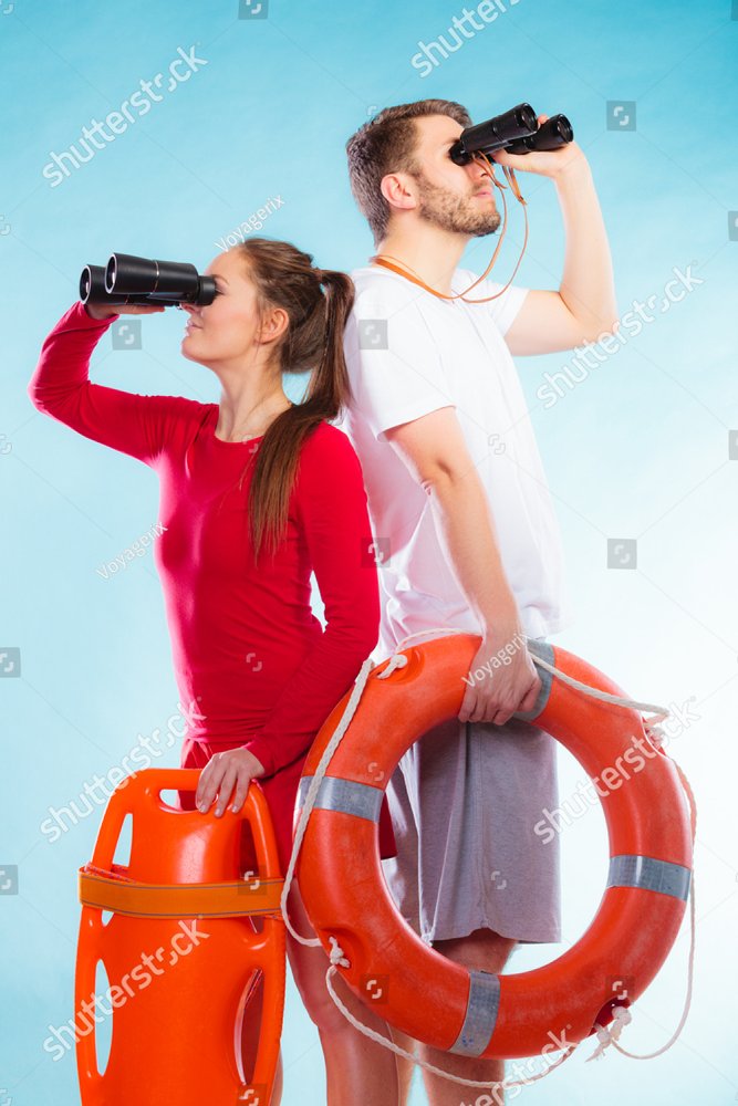 Accident Prevention And Water Rescue. Young Man And Woman Lifeguards On ...