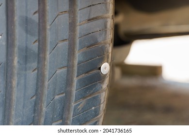 Accident With Punctured Tires. Iron Nail Sticking From Vehicle Tire