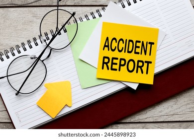 Accident report text on a yellow sticky note on a diary