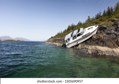 Accident At Sea; Photo Of Recreational Boat On Dry Land After Collision With Coastal Rocks. 