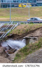 Accident Sewerage System. Water Supply Failure. Breakthrough Of The Water Supply System. A Fountain Of Water Flows Out Of The Sewer Under High Pressure. Wet Soil. Kyiv. Ukraine.