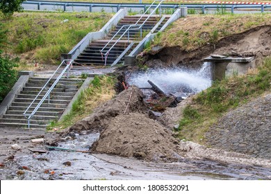 Accident Sewerage System. Water Supply Failure. Breakthrough Of The Water Supply System. A Fountain Of Water Flows Out Of The Sewer Under High Pressure. Wet Soil. Kyiv. Ukraine.