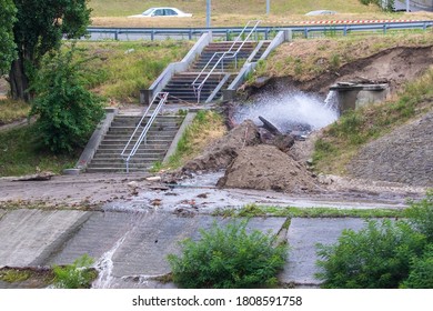 Accident Sewerage System. Water Supply Failure. Breakthrough Of The Water Supply System. A Fountain Of Water Flows Out Of The Sewer Under High Pressure. Wet Soil. Kyiv. Ukraine.