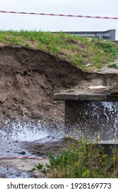 Accident Sewerage System. Water Supply Failure. Breakthrough Of The Water Supply System. A Fountain Of Water Flows Out Of The Sewer Under High Pressure. Wet Soil. Kyiv. Ukraine.