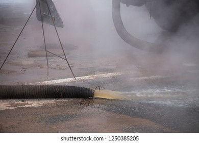 accident tube winter, pipeline supplying city with hot water, boiling water pours through streets, movement of cars is blocked, emergency utilities work, elimination of cloud of hot steam  evaporates