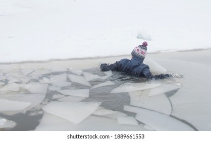 accident, a woman fell through the ice, on a winter day on a pond - Powered by Shutterstock