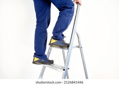 Accident at work prevention concept, worker feet on the ladder