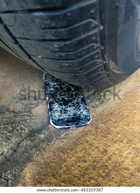 Accident with your mobile
phone.cellphone crashed by car.Smart phone under the wheel.The last
connection.