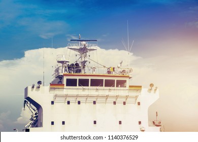 Accommodation Bridge Deck, Antenna Communication On Captain Navigation Room Of Cargo Ship On Sky Blue With Sun Light