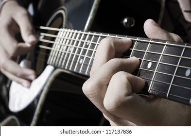 according performed on an acoustic guitar - Powered by Shutterstock