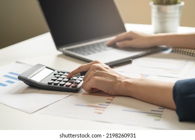 Account Finance, Asian Young Business Woman Hand Use Calculator For Calculate Budget, Cost And Income Of Company From Charts, Reports Paperwork, Plan Spend Money Expenses, Working On Desk At Home.