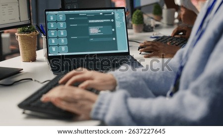 Account manager using AI chatbot for help in talking with customers and identifying sales opportunities. Employee in office using artificial intelligence LLM for help in generating leads, camera A