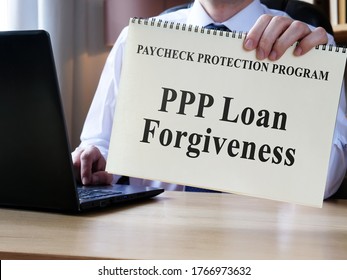 Accountant Shows Form For PPP Loan Forgiveness.