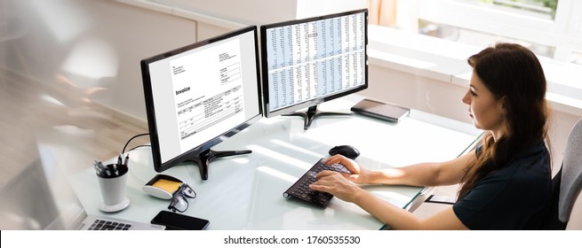 Accountant Using E Invoice Software At Computer In Office