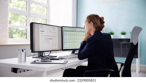 Accountant Using E Invoice Software At Computer In Office