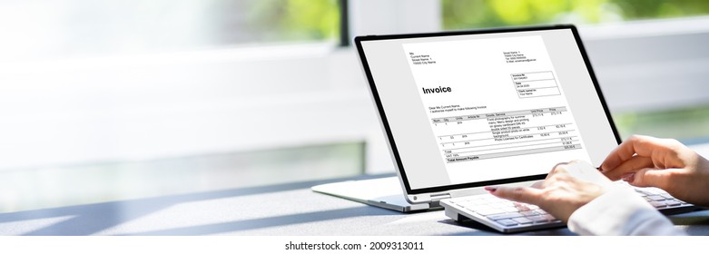 Accountant Using Online E Invoice Software On Tablet