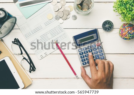 Accountant verify the Saving Account Book and Statement of financial statements / Bookkeeping / Accountancy Concept.