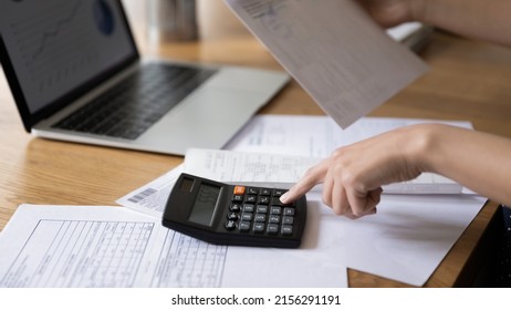 Accountant woman calculating expenses, fees, analyzing financial reports, counting money, company budget, costs, reviewing bills, checking taxes, vat. Banner shot, close up of hands
