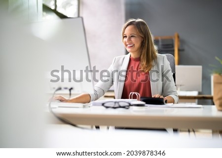Accountant Women At Desk Using Calculator For Accounting