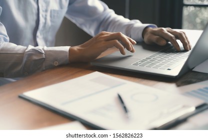 Accountant working with data documents calculating on business report. 
