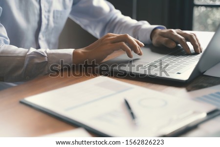 Accountant working with data documents calculating on business report. 
