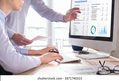 Accountants Working On Financial Statement On Computer Screen In Office. Team Of Consulant Auditing Finance And Business Operations Reports With Income Data. Corporate Management And Governance