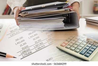 Accounting Business Concept. Calculator With Accounting Report And Financial Statement On Desk.