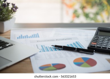 Accounting Business Concept. The Report Summarizes The Results Of Business Operations, Pen, Calculator On Desk Of Investor.