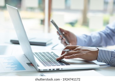 Accounting Businessman Working On Laptop Computer And Analyzing Real Estate Investment Data, Financial And Tax Systems Concept.