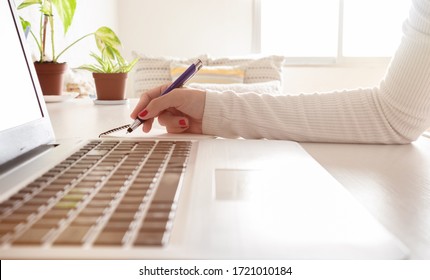Accounting businesswoman working using laptop at home, telecommuting, working remotely during quarantine - Shutterstock ID 1721010184