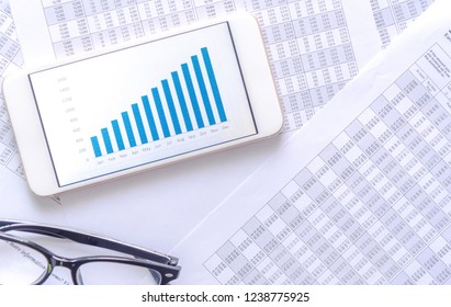 Accounting data document with graph on mobile phone