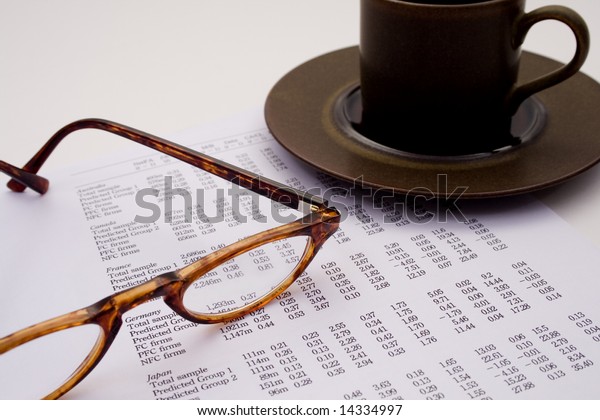 Accounting and\
finances with coffee and\
glasses