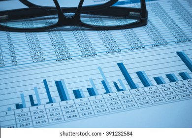 Accounting Financial Bank Banking Account Stock Spreadsheet Data With Glasses In Blue 