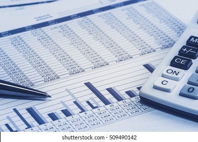 Accounting financial banking banker bank stock spreadsheet data with pen and calculator in blue analysis analyzer calculations 