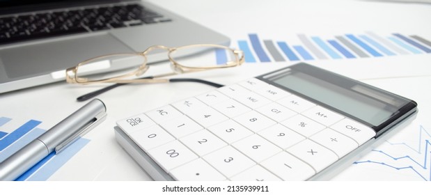 Accounting, laptop, pen and calculator. Business concept. High quality photo