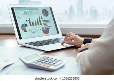 Accounting report spreadsheet. Business women using computer prepare business report for evaluation performance. - Shutterstock ID 1056258833
