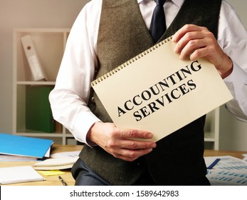 Accounting Services Sign In The Hands Of Accountant.