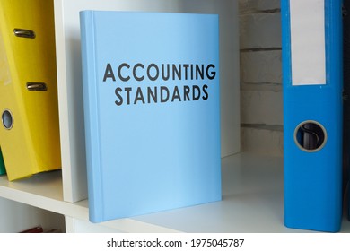 Accounting Standards Book On The Shelf With Folders.